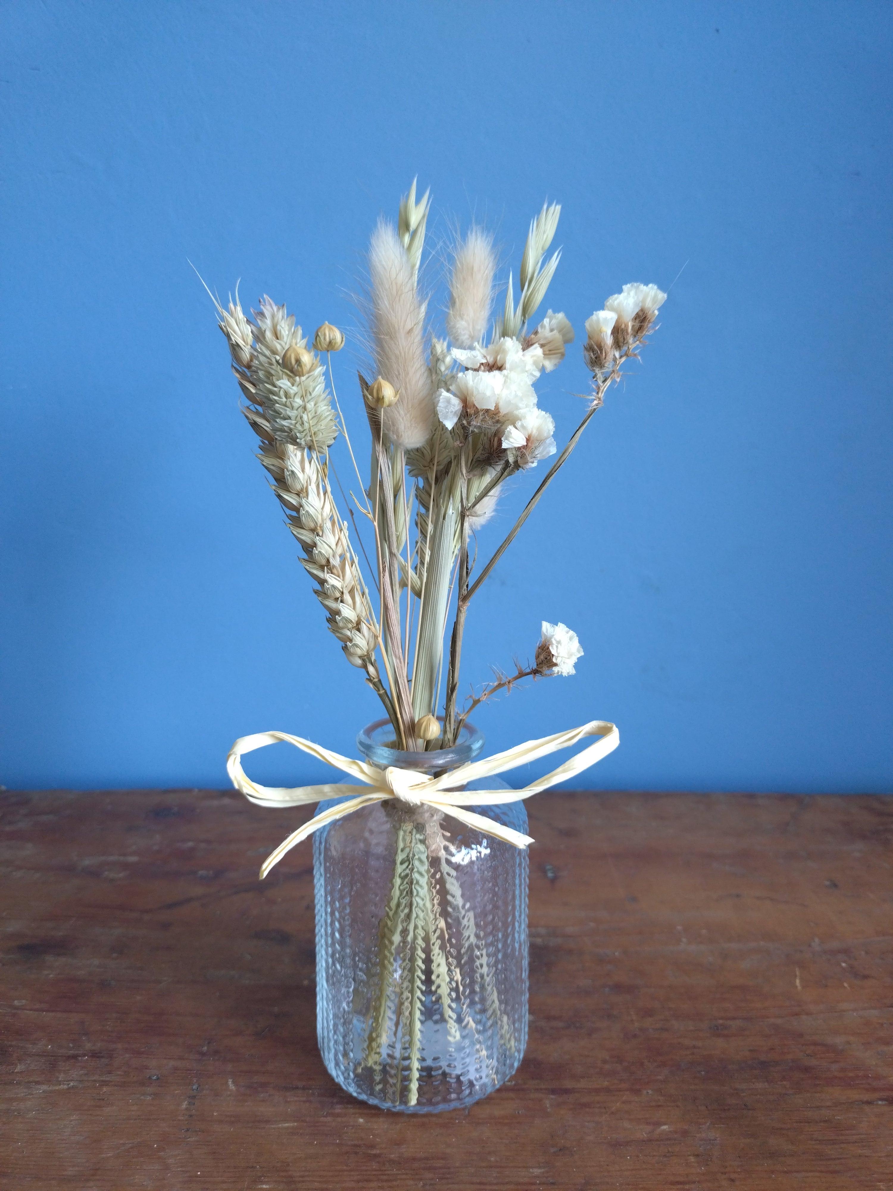 Dried flower posy and vase